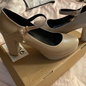 Maryjane’s tan chunky heels